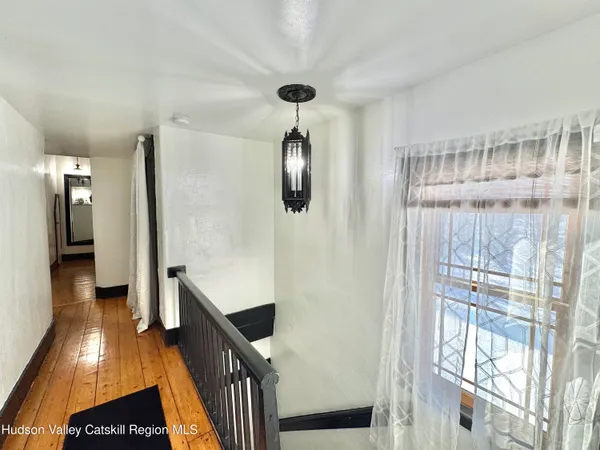 a front view of a multi story building with yard