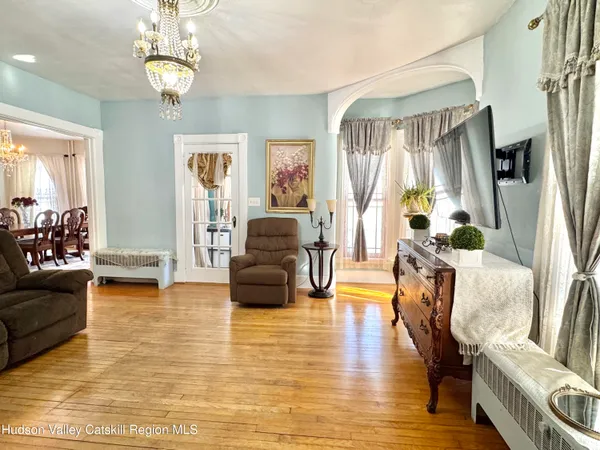 a view of a dining room with furniture window and wooden floor