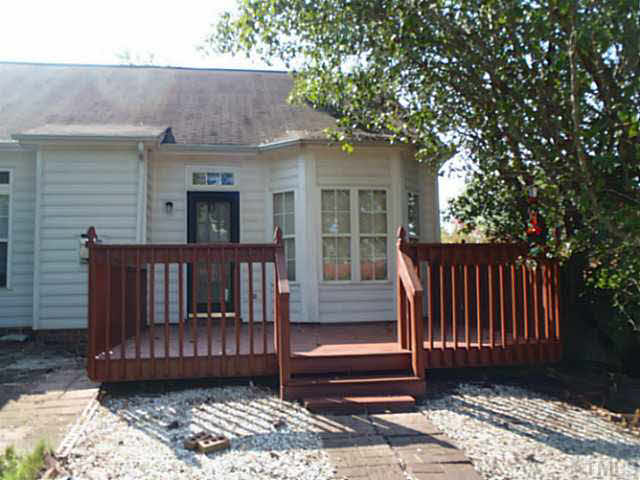 5832 Solitude Way Durham, NC 27713 - Photo 11 of 20 a view of a deck with a large window and wooden fence