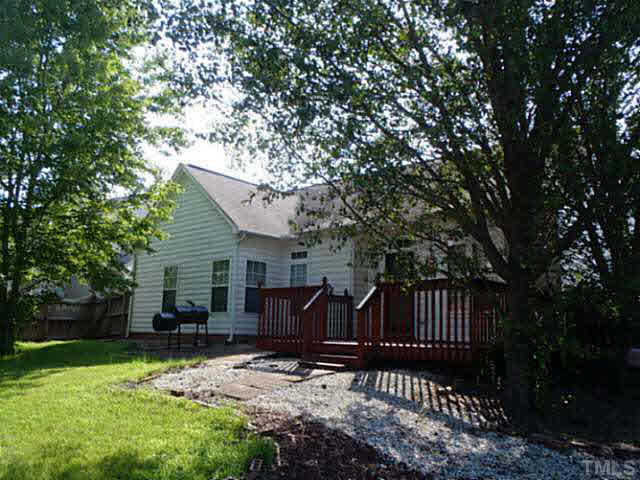 5832 Solitude Way Durham, NC 27713 - Photo 12 of 20 a view of backyard with deck and garden