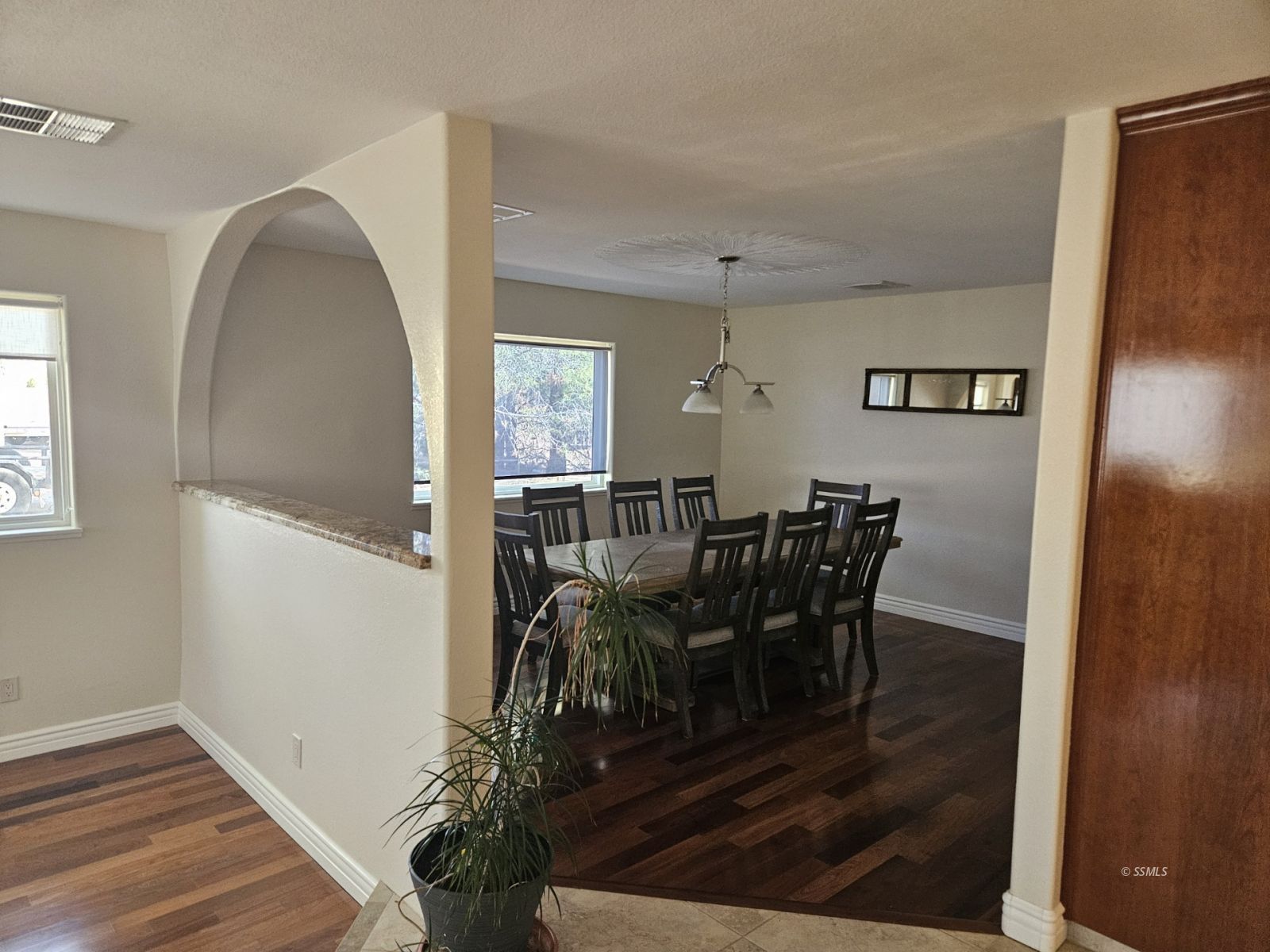 928 North Brady Street Ridgecrest, CA 93555 - Photo 4 of 21 a view of a dining room with furniture and wooden floor