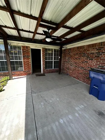 a view of a room with wooden walls