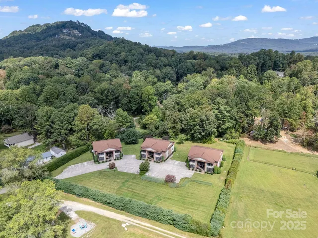 a view of a two dinning table and chairs in the outdoor
