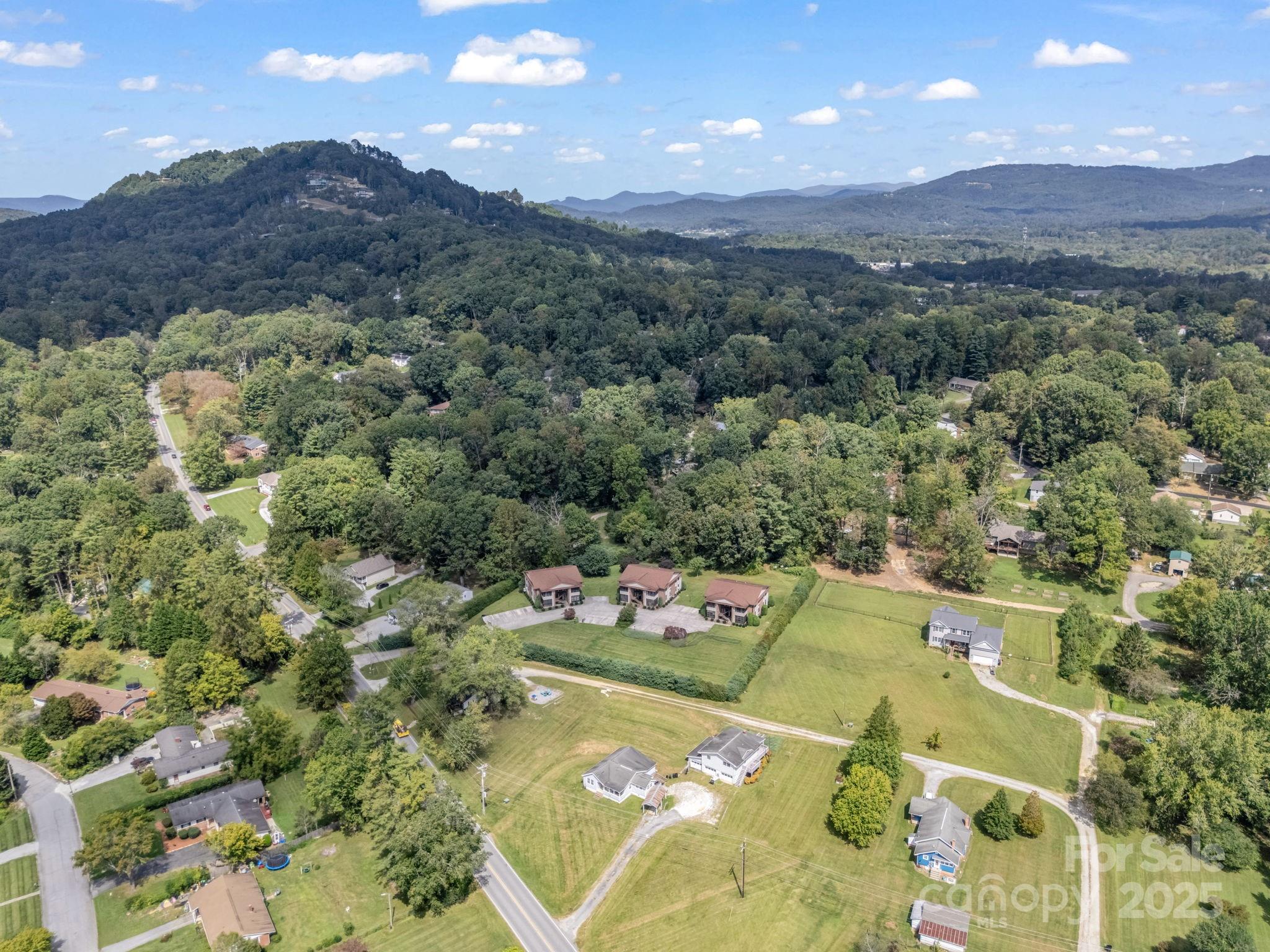 45 Indian River Road Hendersonville, NC 28791 - Photo 13 of 19 a view of a swimming pool and mountains