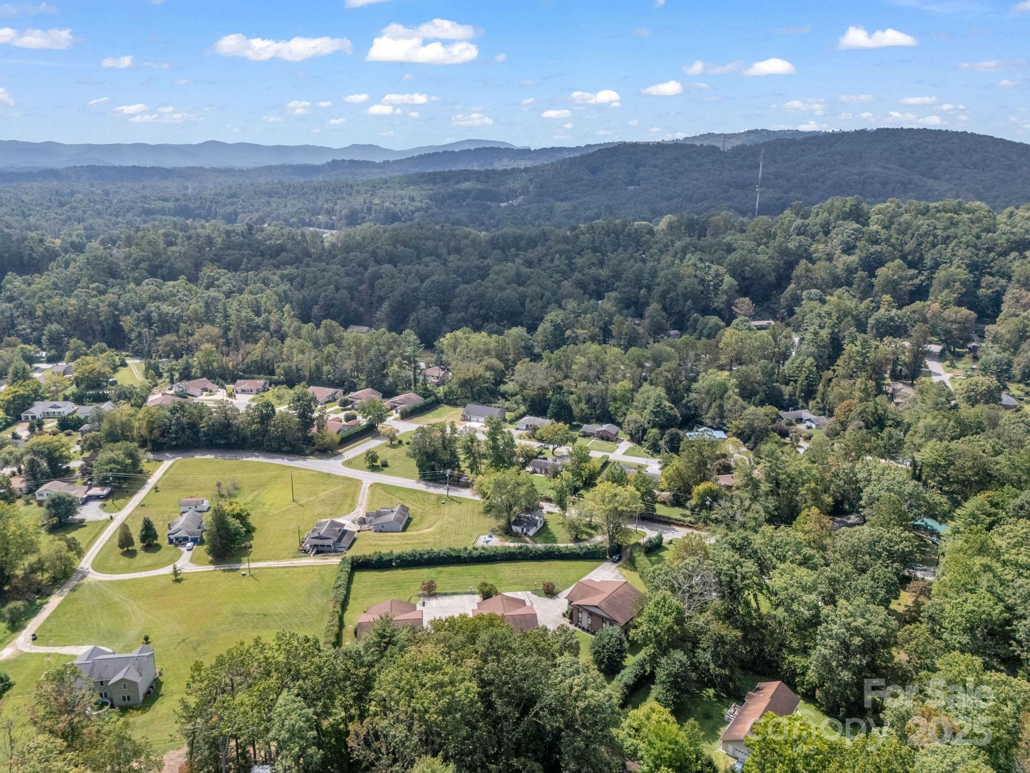 45 Indian River Road Hendersonville, NC 28791 - Photo 16 of 19 an aerial view of residential houses with outdoor space and swimming pool
