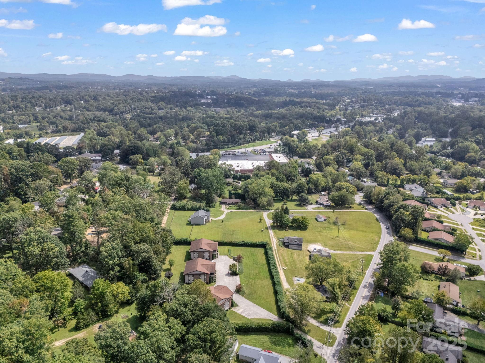 45 Indian River Road Hendersonville, NC 28791 - Photo 18 of 19 an aerial view of residential houses with outdoor space and swimming pool