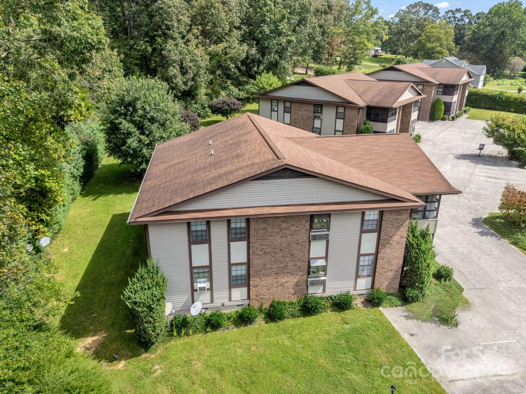 45 Indian River Road Hendersonville, NC 28791 - Photo 9 of 19 a aerial view of a house with yard and plants