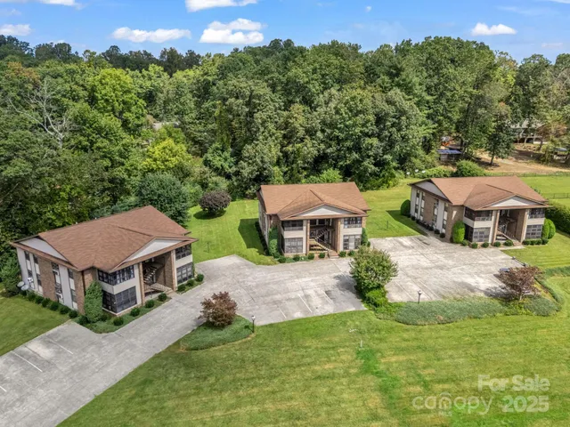 an aerial view of a house with a big yard