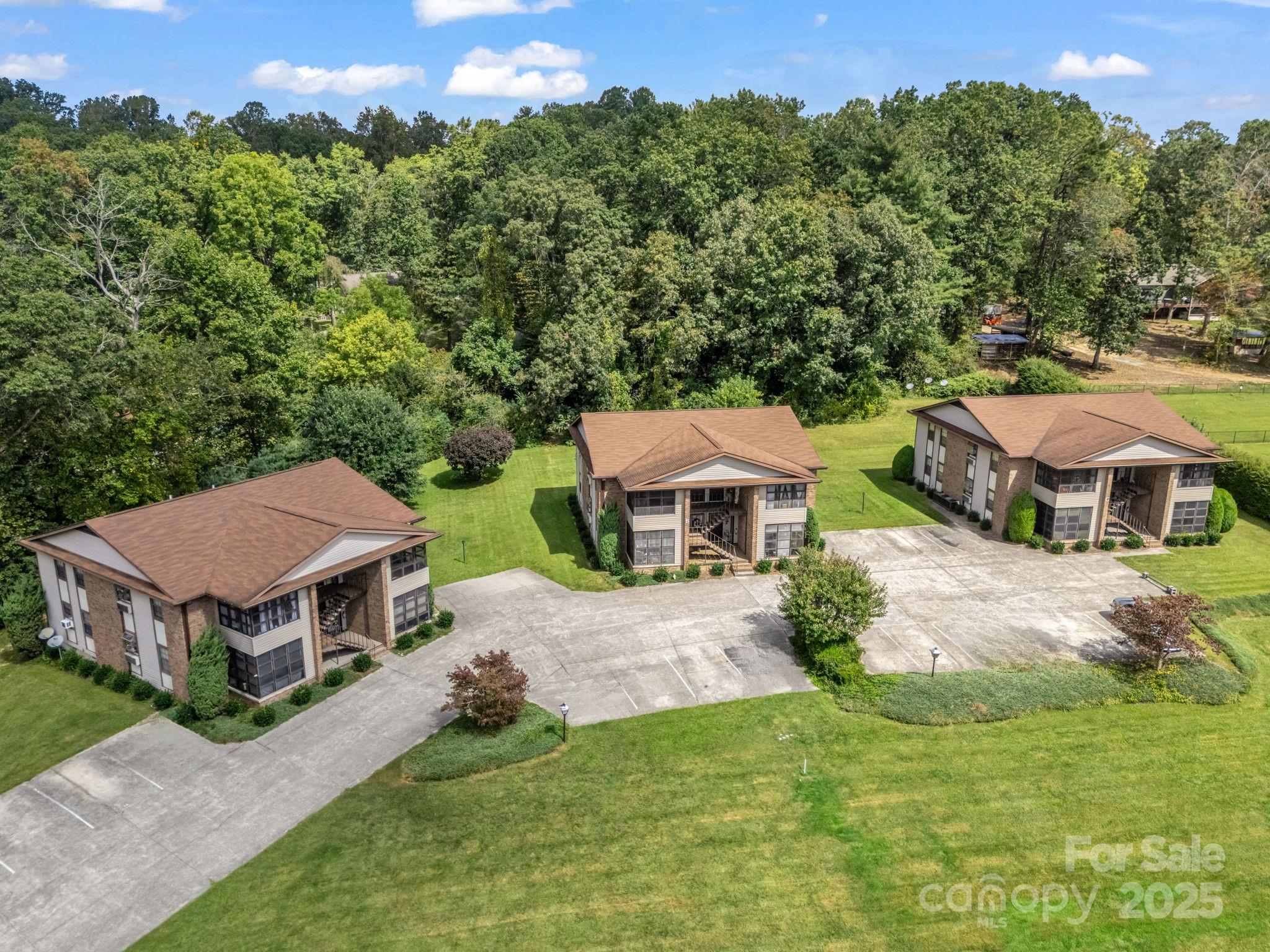 45 Indian River Road Hendersonville, NC 28791 - Photo 10 of 19 an aerial view of a house with a big yard