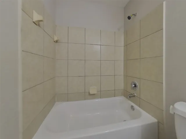 a bathroom with a sink toilet and vanity