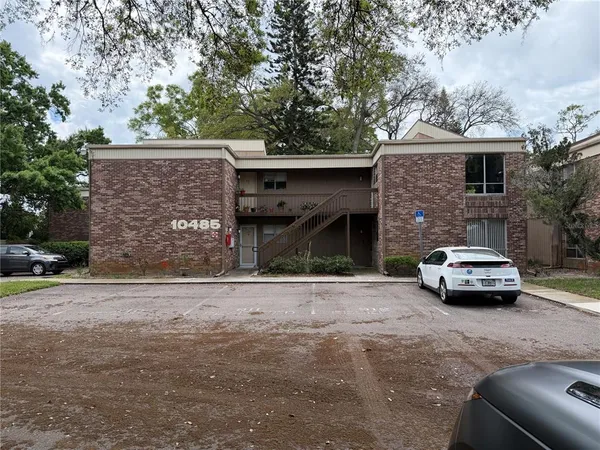 a front view of a house with parking space