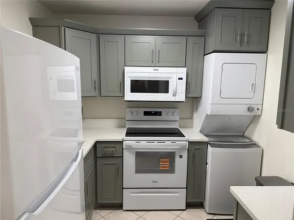 a kitchen with a stove and a microwave