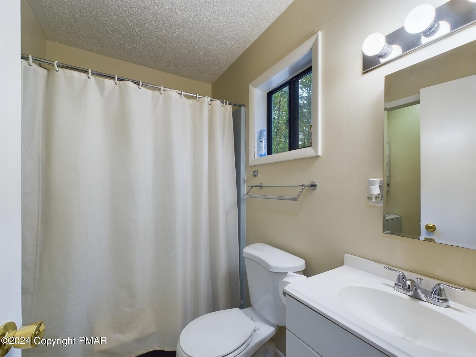 1245 Ranger Trail Pocono Lake, PA 18347 - Photo 23 of 59 a bathroom with a sink and a toilet