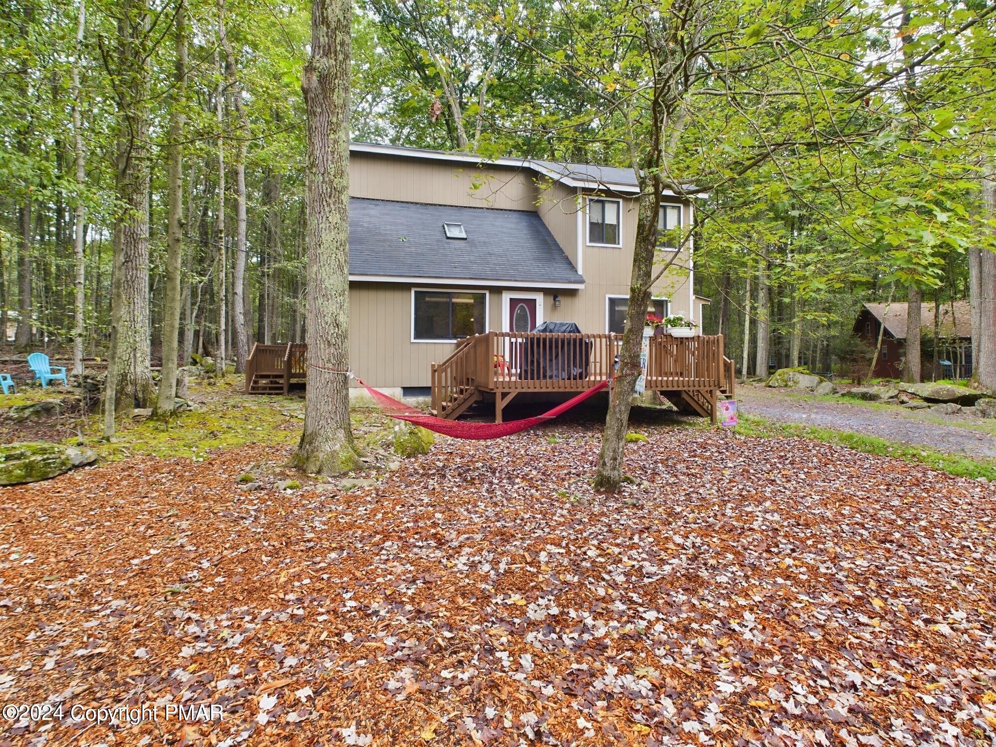 1245 Ranger Trail Pocono Lake, PA 18347 - Photo 41 of 59 a front view of a house with a yard