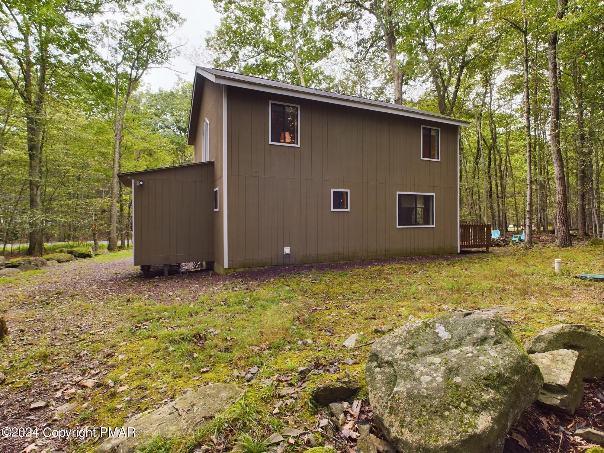 1245 Ranger Trail Pocono Lake, PA 18347 - Photo 43 of 59 a backyard of a house with lots of green space