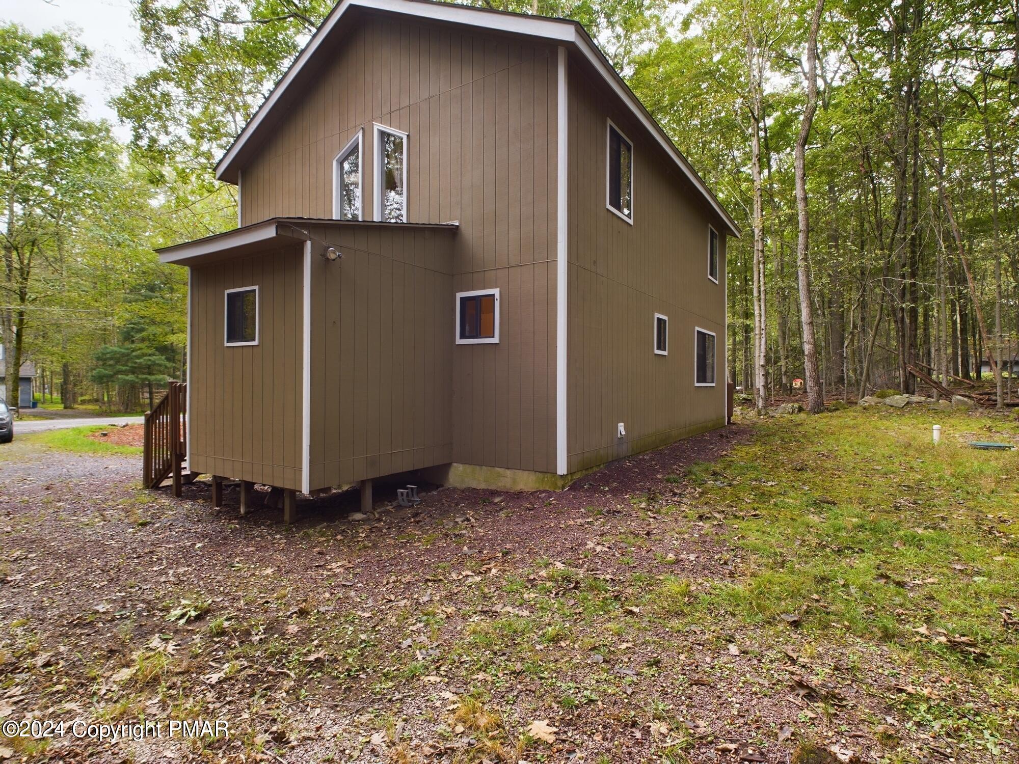 1245 Ranger Trail Pocono Lake, PA 18347 - Photo 44 of 59 a view of a house with a yard
