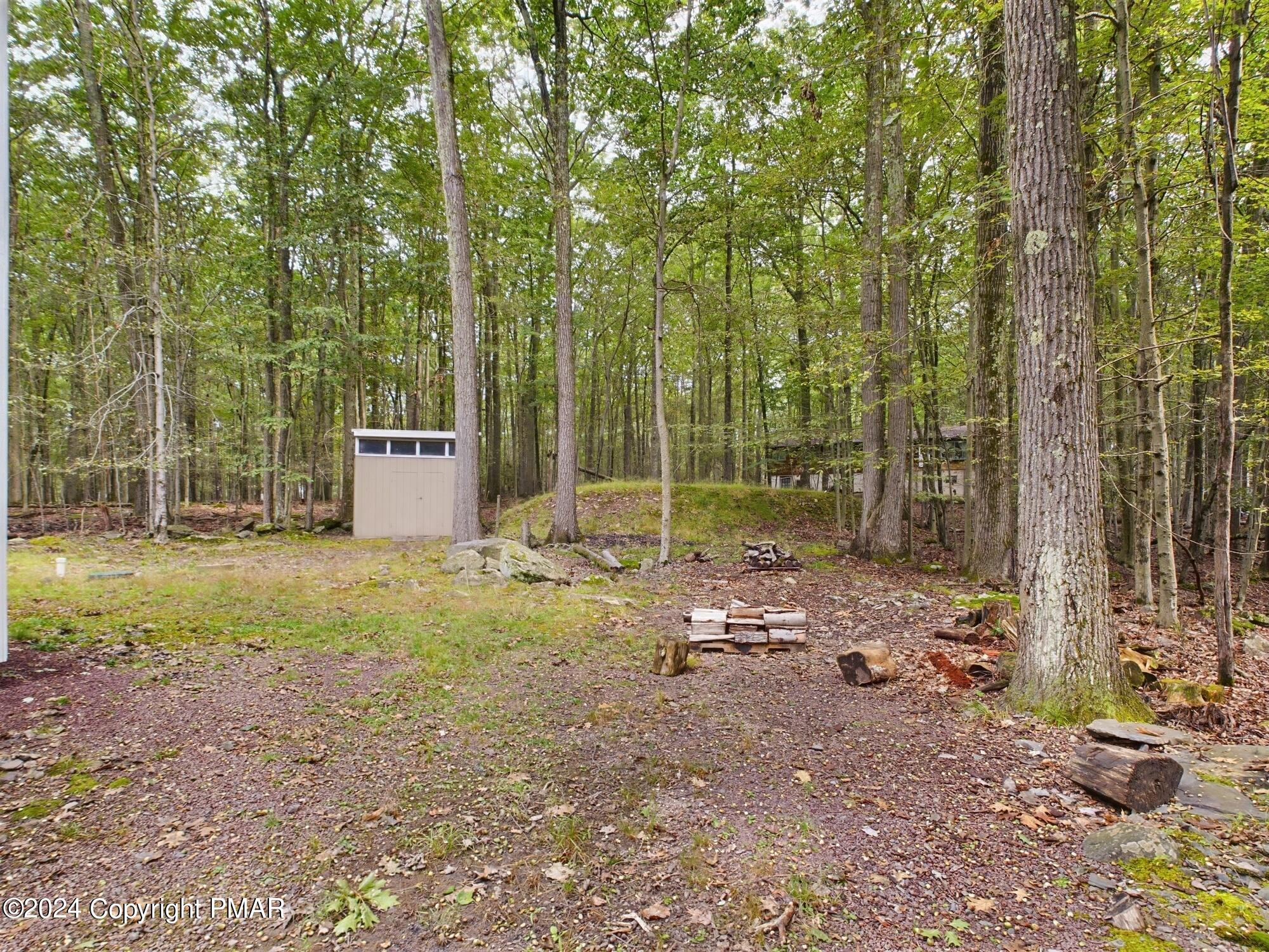 1245 Ranger Trail Pocono Lake, PA 18347 - Photo 46 of 59 a backyard of a house with lots of green space