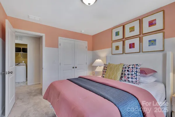 a bedroom with a bed and a book shelf