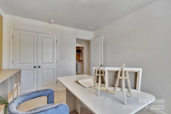a dining room with furniture and wooden floor