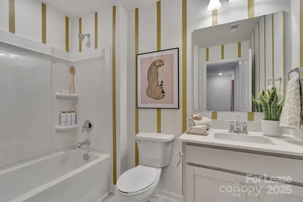 a bathroom with a toilet a sink and a bathtub