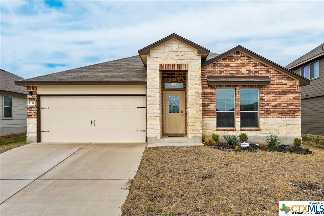 2351 Pintail Loop Copperas Cove, TX 76522 - Photo 1 of 1 a front view of a house with garden