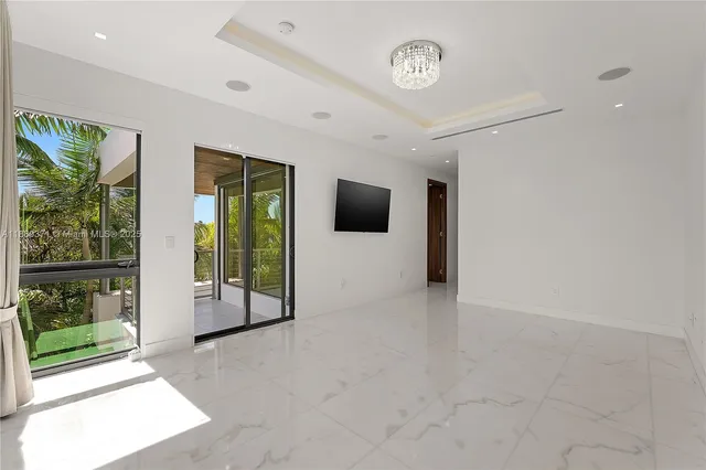 a view of a livingroom with furniture window and front door