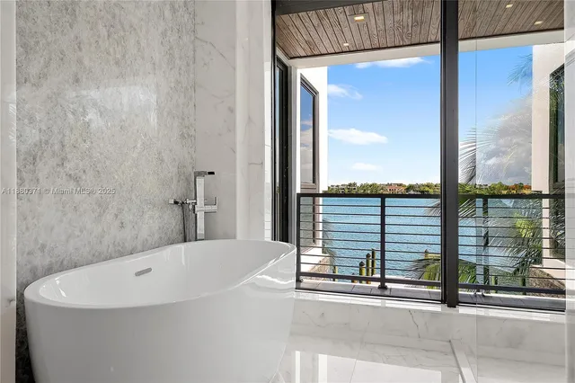 a bathroom with a bathtub and window