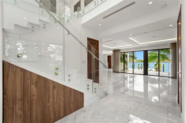 a view of an entryway with wooden floor
