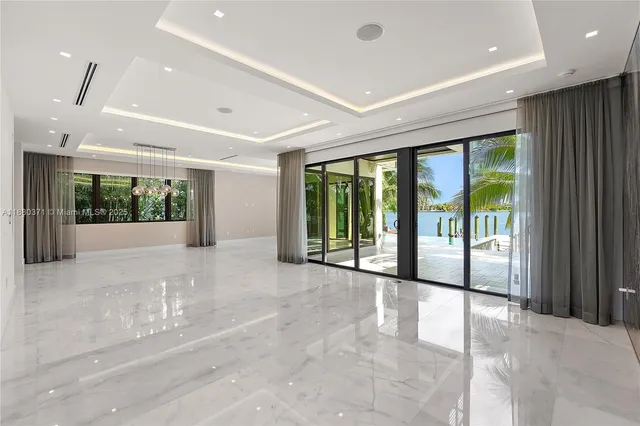 a view of an entryway with floor to ceiling windows and an entryway