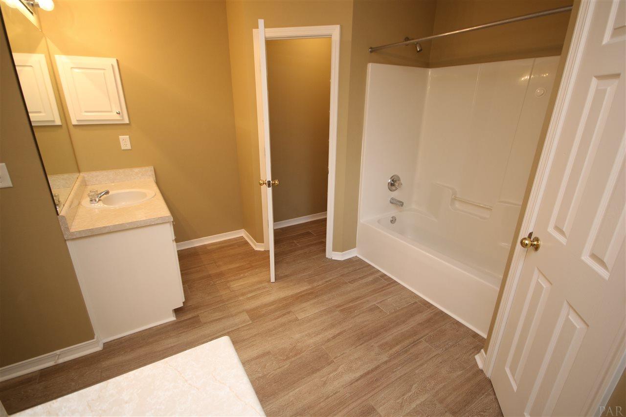3750 Berrypatch Lane Pace, FL 32571 - Photo 34 of 45 to the left of tub. New shower head 5/2020.