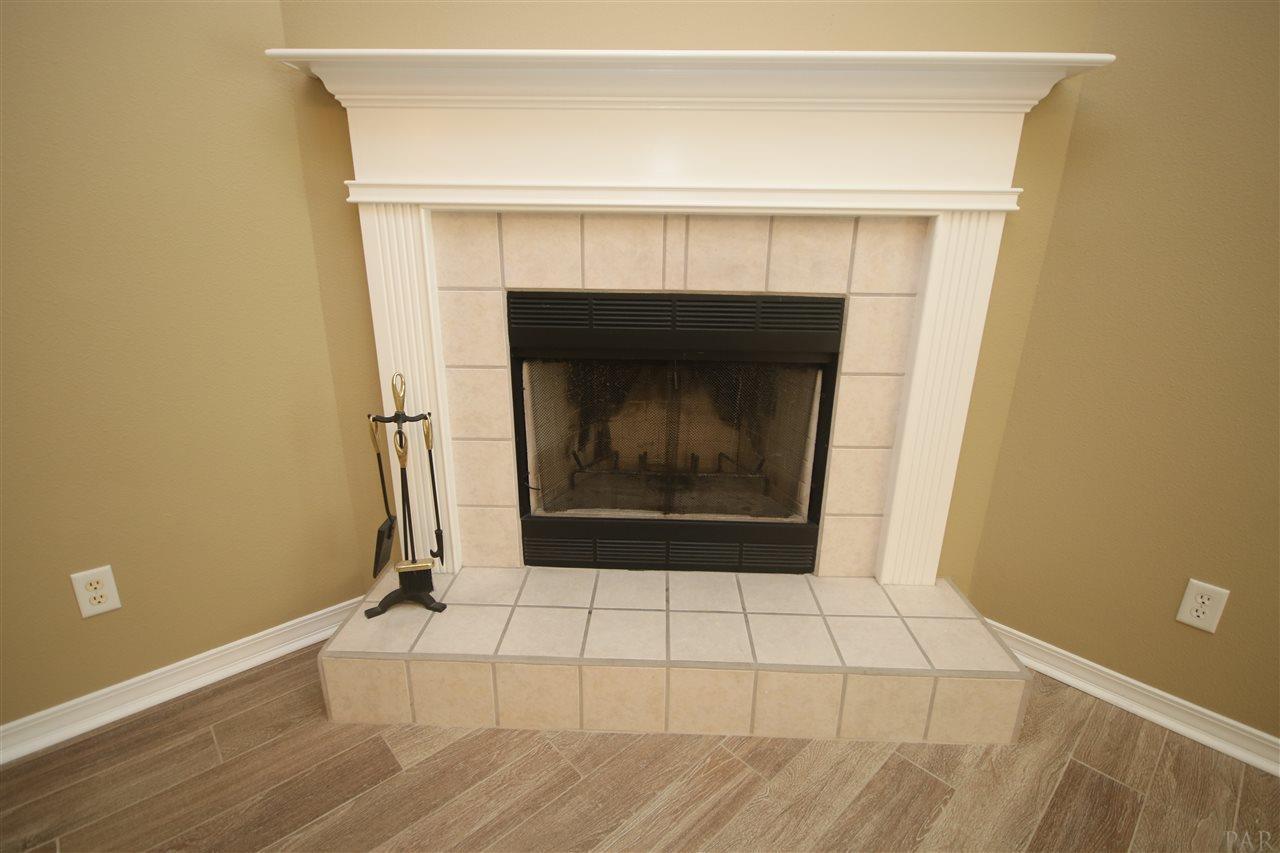 3750 Berrypatch Lane Pace, FL 32571 - Photo 8 of 45 with tile face & raised hearth.