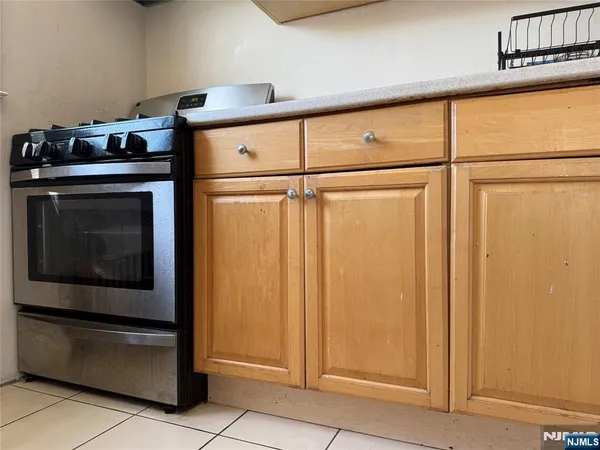 a kitchen with a stove and a refrigerator