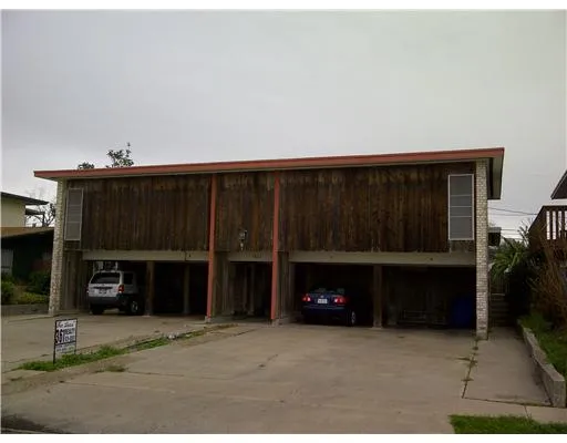 a view of an empty room with fire place and a fireplace