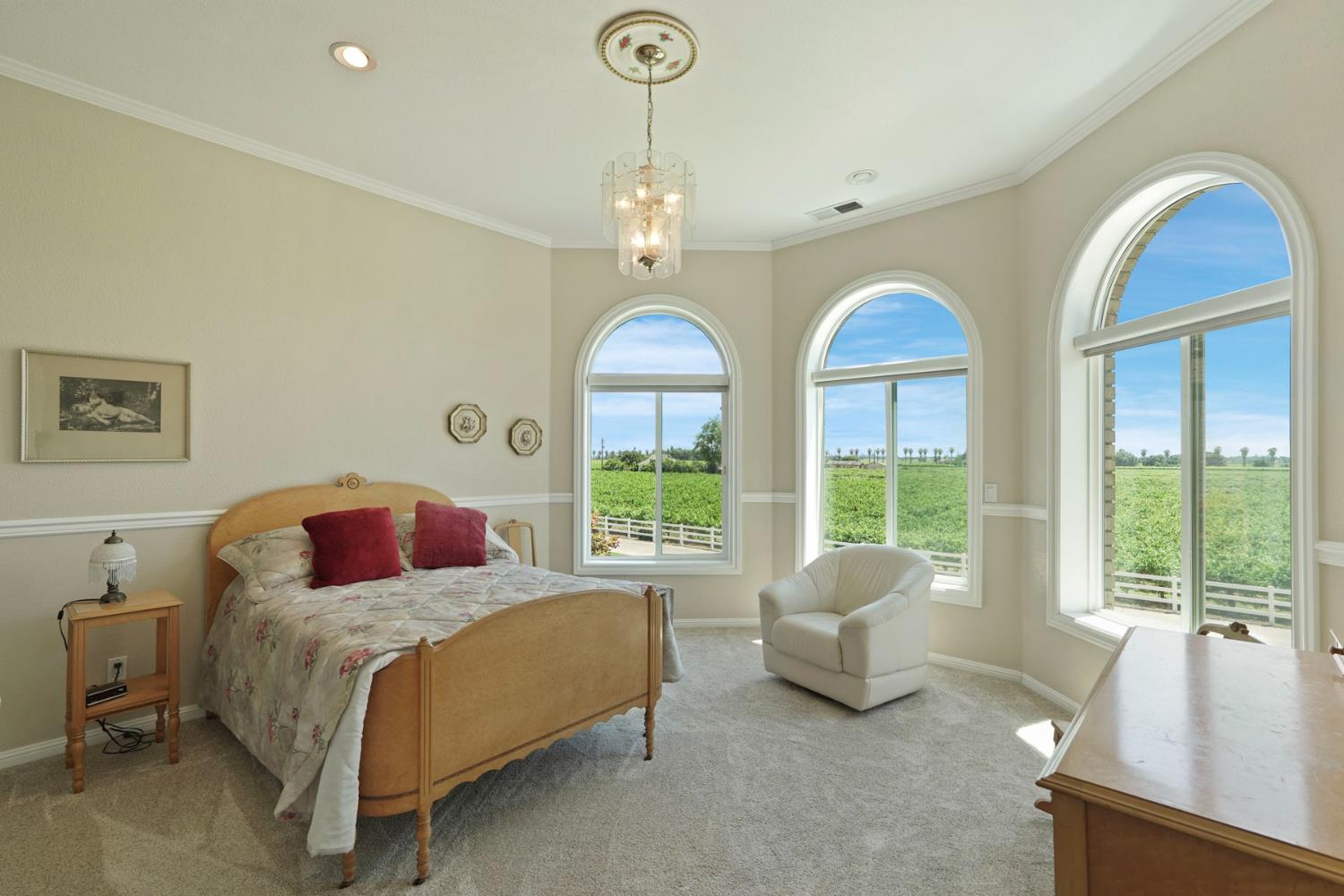 21649 Des Moines Road Acampo, CA 95220 - Photo 20 of 34 a spacious bedroom with a bed and a large window