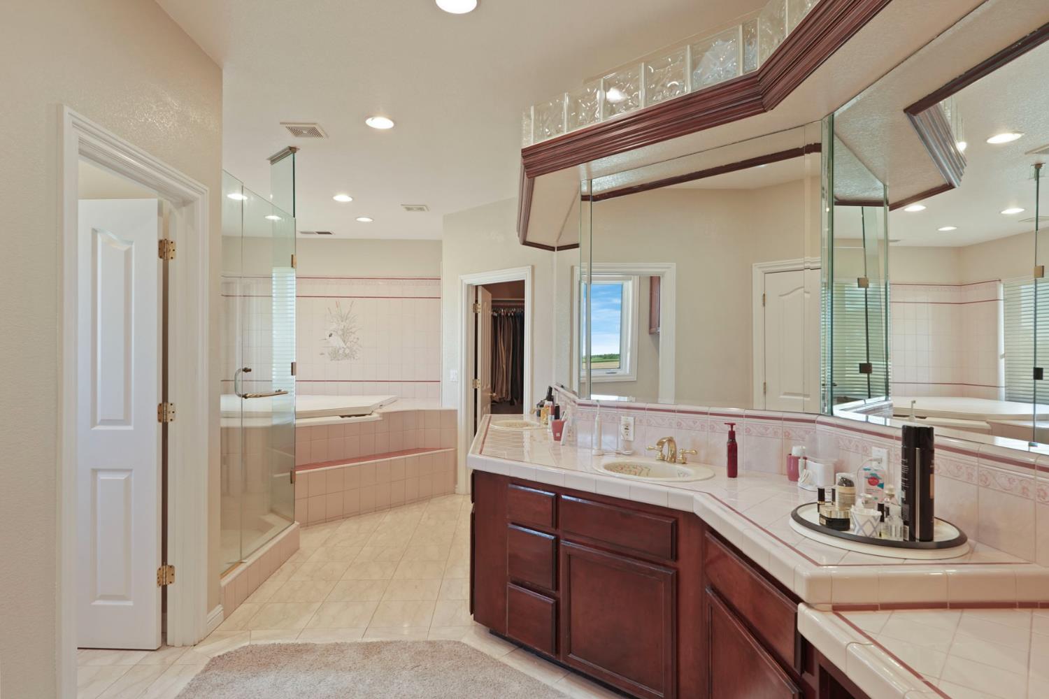 21649 Des Moines Road Acampo, CA 95220 - Photo 24 of 34 a bathroom with a granite countertop sink mirror and double