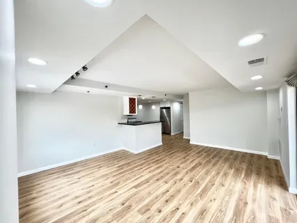 a view of a kitchen with wooden floor