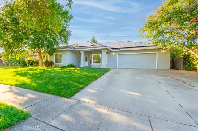 a front view of house with yard and green space