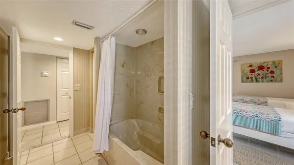 a bathroom with a granite countertop sink mirror and a toilet