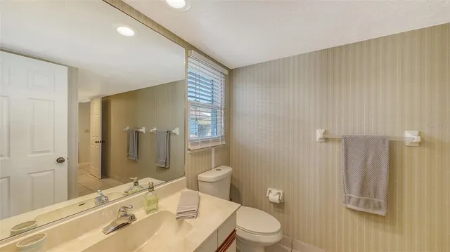 a bathroom with a double vanity sink mirror and shower