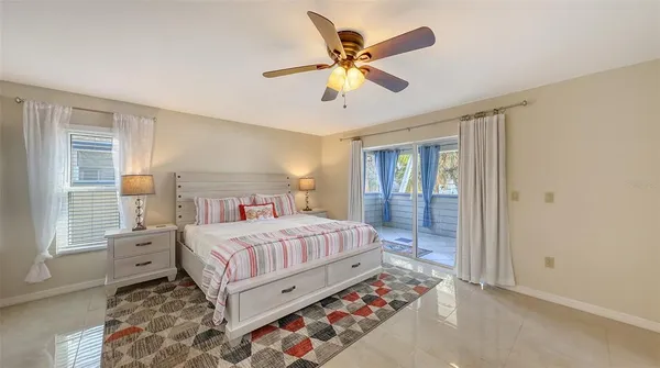 a view of a balcony with furniture and wooden floor
