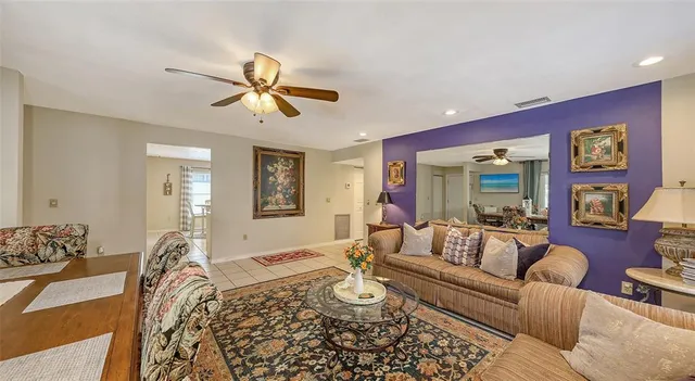 a kitchen with a sink dishwasher a stove and white cabinets