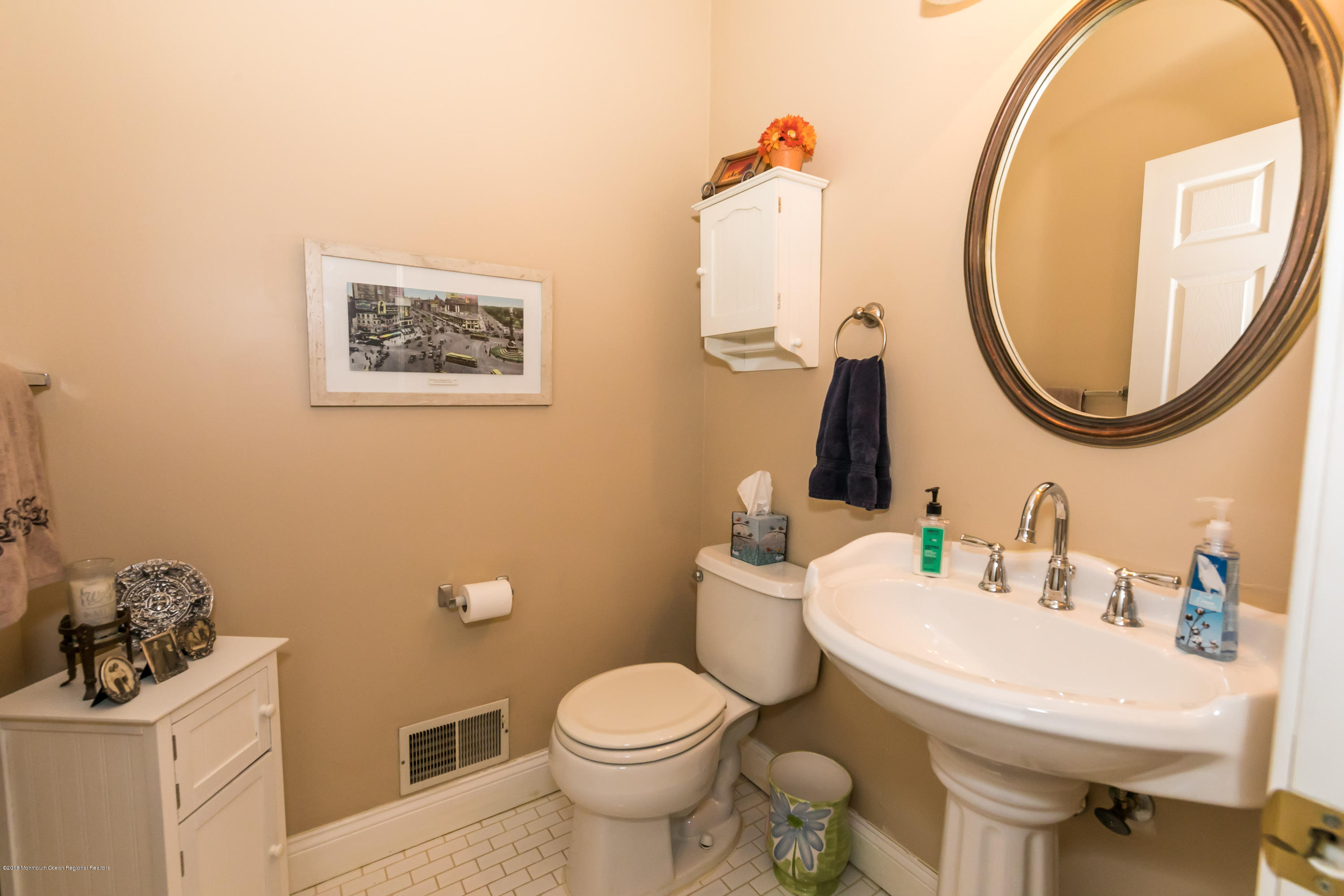 421 Diamond Road Jackson, NJ 08527 - Photo 7 of 24 a bathroom with a toilet a sink and a mirror