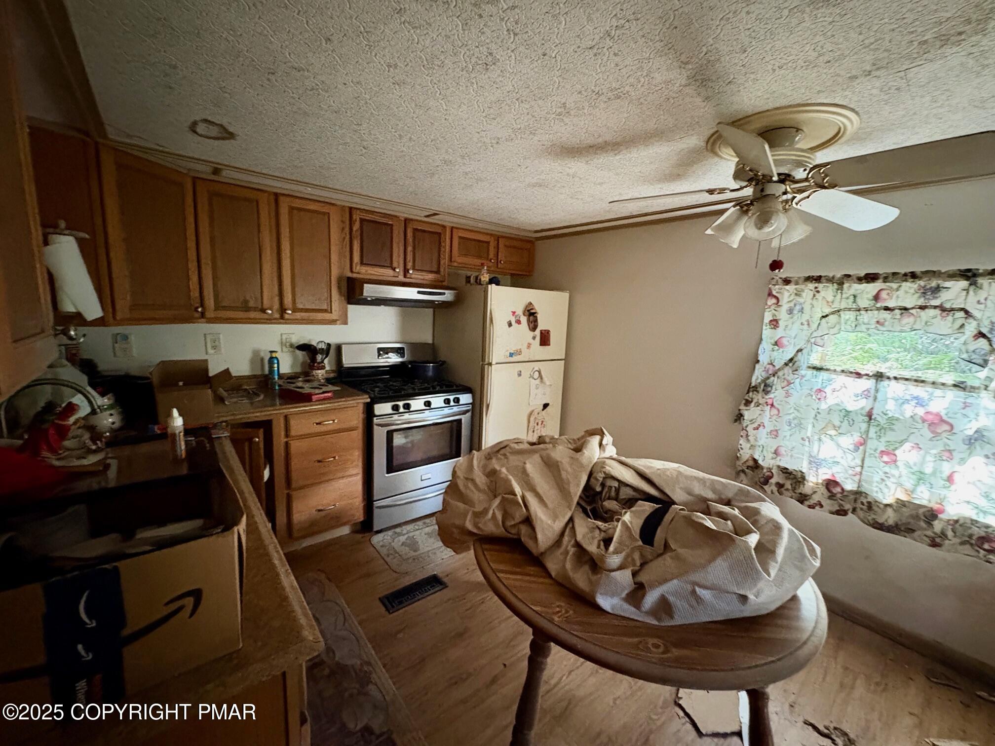 197 Koehler Road Saylorsburg, PA 18353 - Photo 4 of 9 a kitchen with a sink appliances and cabinets