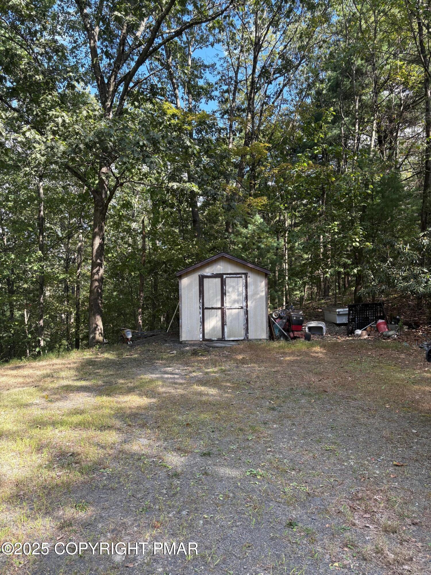 197 Koehler Road Saylorsburg, PA 18353 - Photo 8 of 9 a big house with a tree in front of it