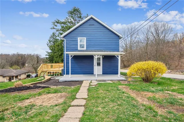 an aerial view of residential house with outdoor space