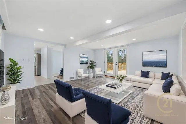 a living room with kitchen island furniture and a wooden floor