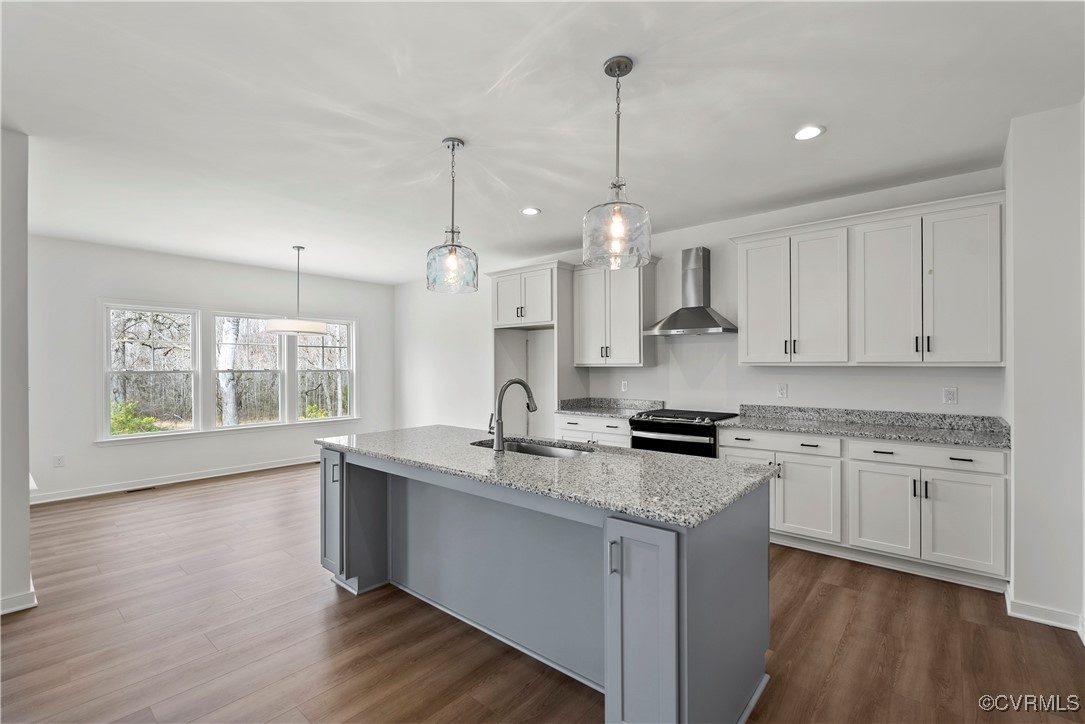 2-2 Old Telegraph Road Providence Forge, VA 23140 - Photo 4 of 19 a kitchen with granite countertop a stove a sink a center island and wooden floor