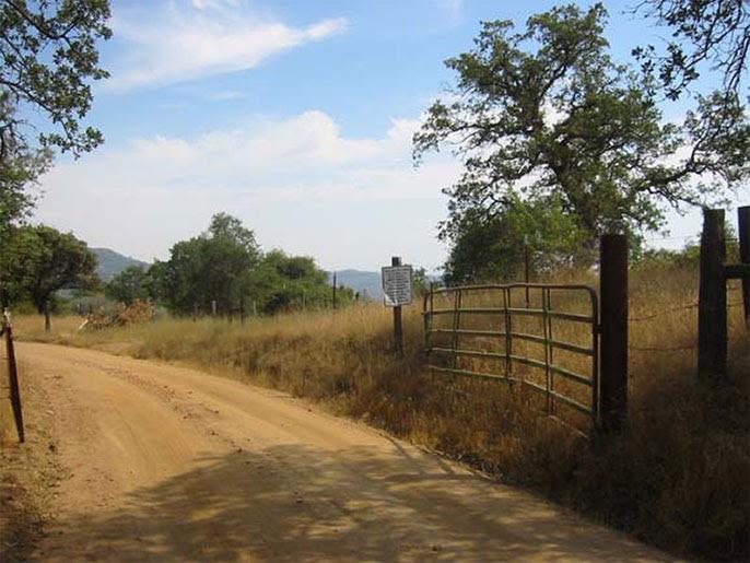 4195 Stumpfield Mountain Road Mariposa, CA 95338 - Photo 1 of 14 a view of a lake from a yard