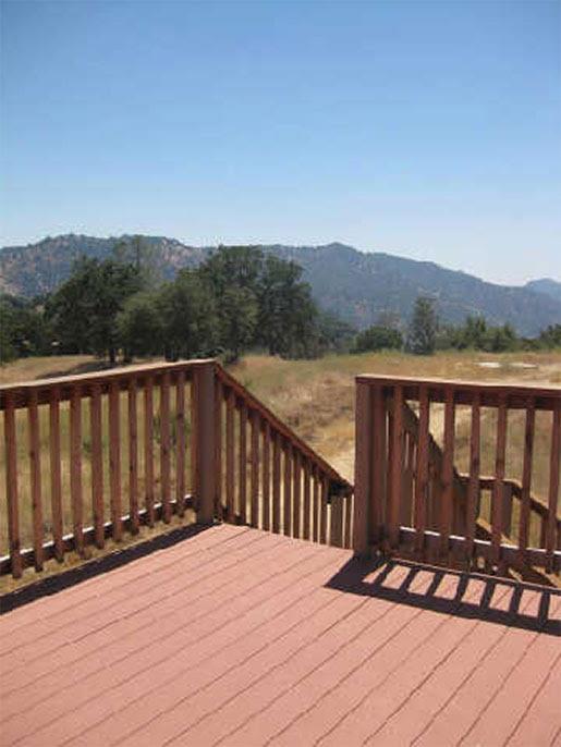 4195 Stumpfield Mountain Road Mariposa, CA 95338 - Photo 6 of 14 a view of balcony with wooden floor and fence