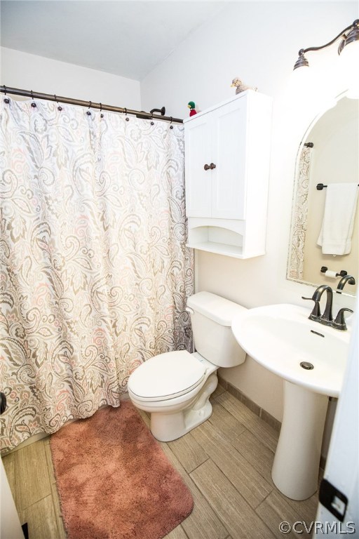 18196 Old Ridge Road Montpelier, VA 23192 - Photo 27 of 40 a bathroom with a sink toilet and shower